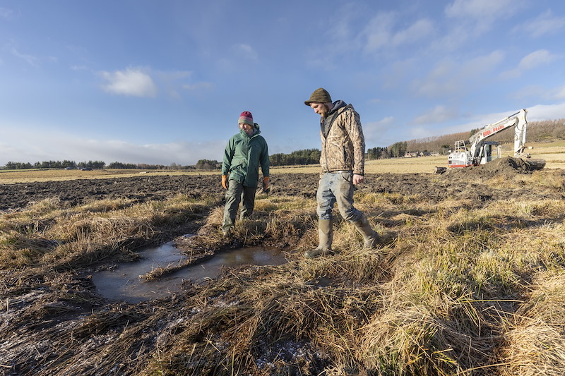 Landowner, Laurel Foreman,and contractor discussing creation of wetland habitat, Wark Farm, Aberdenshire
