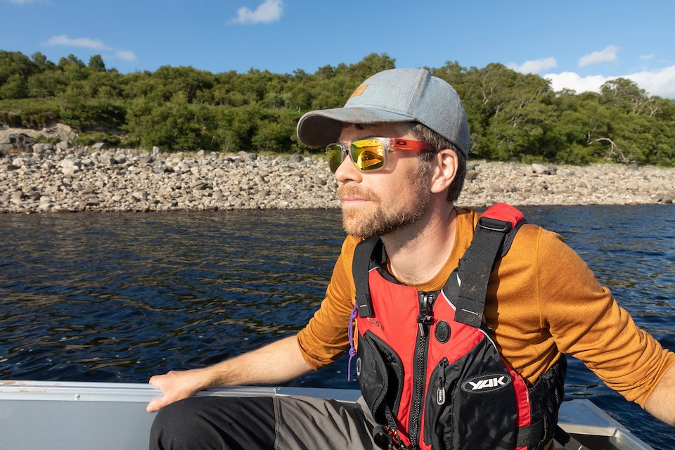 Andrew Spence aboard boat on Loch Shin, Overscaig, Sutherland