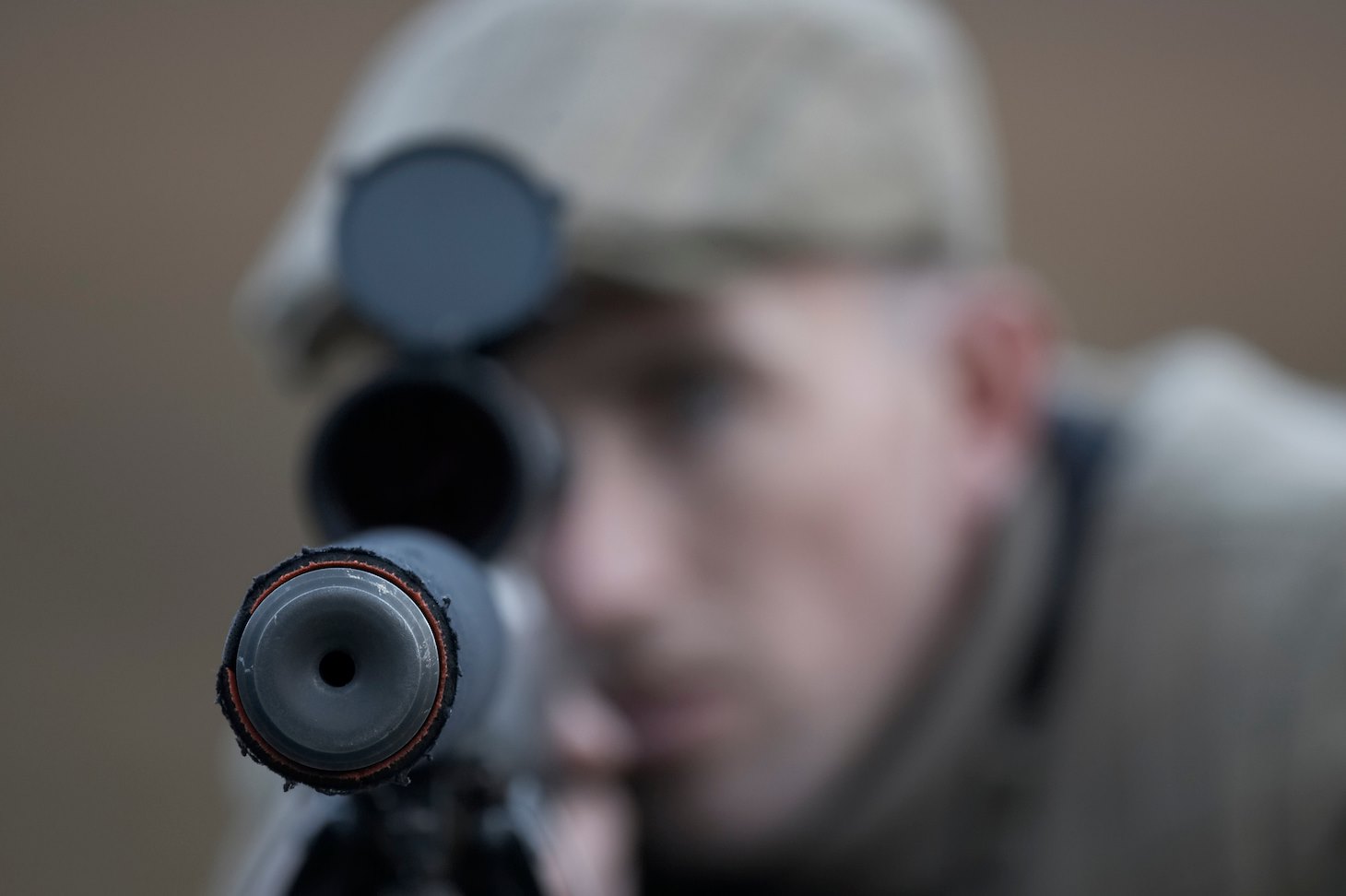 Close up of deer stalker and rifle, Alladale Wilderness Reserve, Sutherland, Scotland.